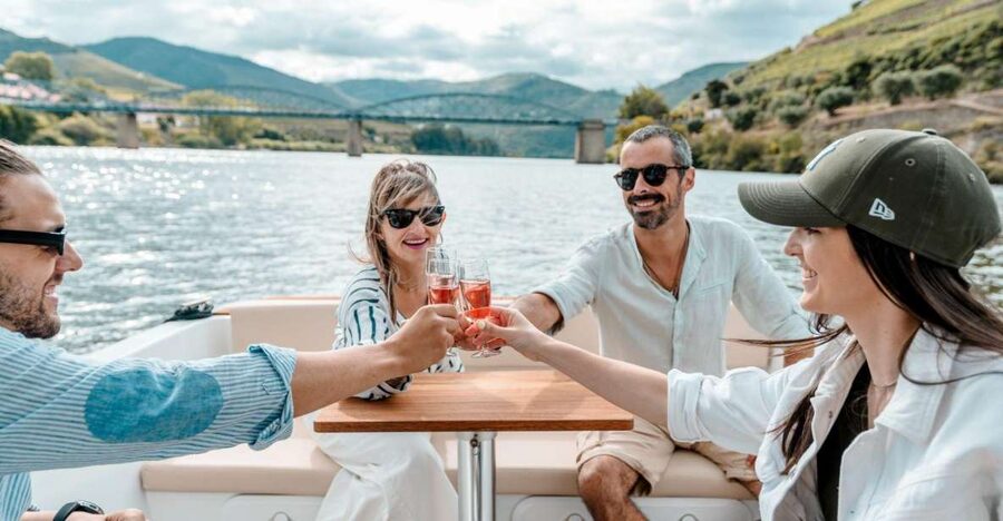 Pinhão: Douro River Solar Boat Tour with Wine Tasting - Wine Tasting on Board: Adega de Favaios in Two Glasses