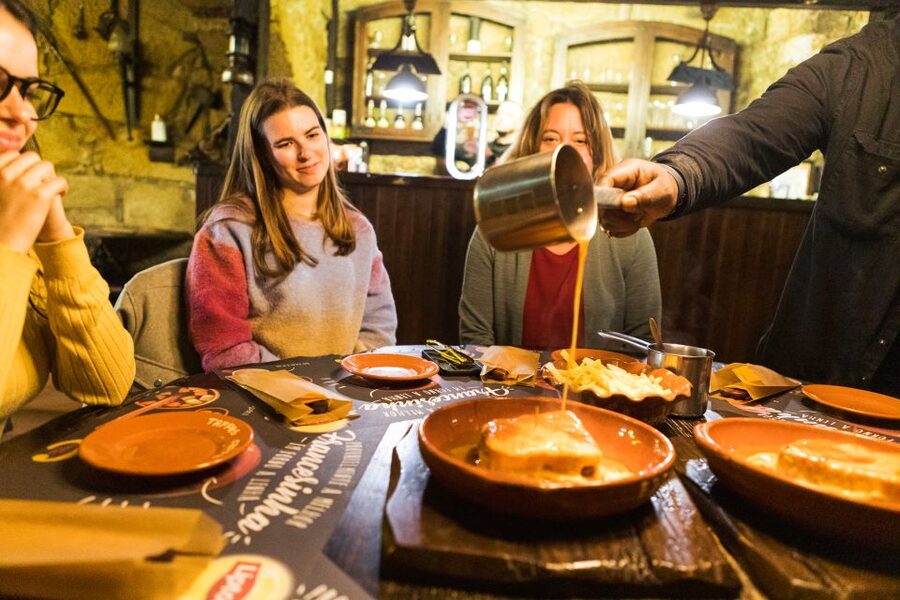 Porto: Food & Wine Tasting Walking Tour with Port Wine Cave - Entering the centuries-old Port wine cellar, why it matters