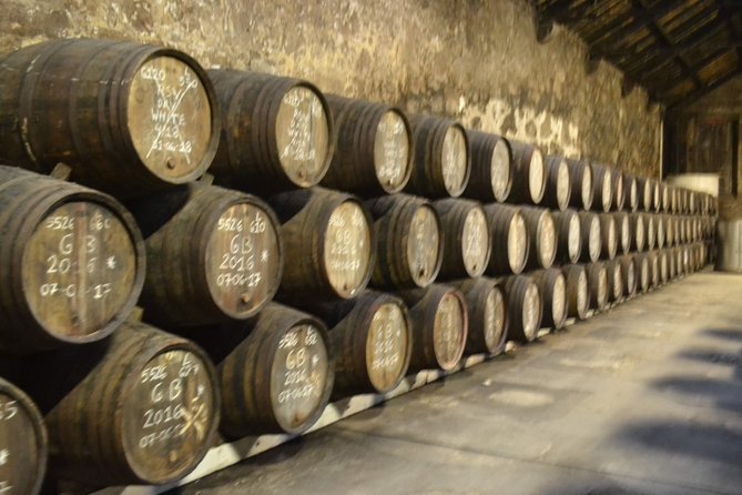 Porto: Port and Douro Wine Walking Tour With 9 Wine Tastings - Stop 3 at Fonseca Porto: A Proper Cellar Visit and Port Lesson