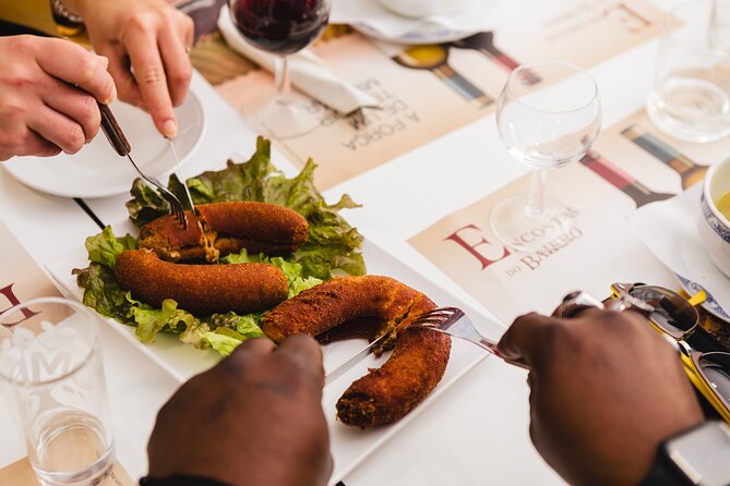 Porto Wine & Dine: Port Wine Cave Food Tour with Eating Europe - Rua Luís de Camões: Alheira, history, and a dish with a backstory